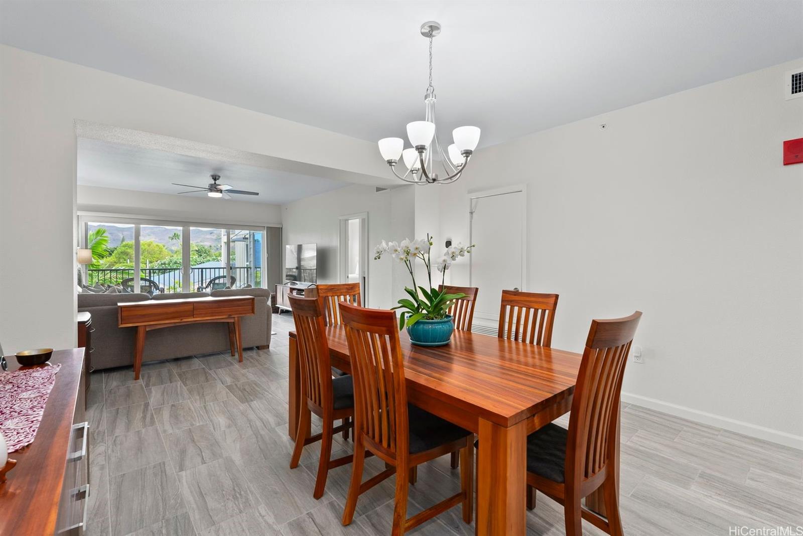 361 Kailua Road, Unit RD8205 Kailua, HI 96734 - Photo 5 of 23 a view of a dining room with furniture window and wooden floor