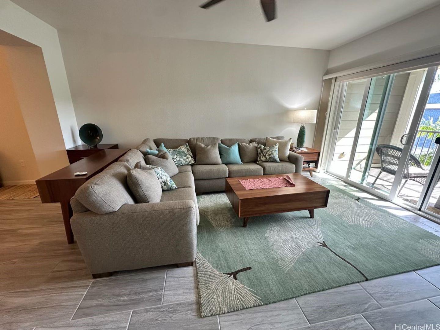 361 Kailua Road, Unit RD8205 Kailua, HI 96734 - Photo 8 of 23 a living room with furniture and a floor to ceiling window