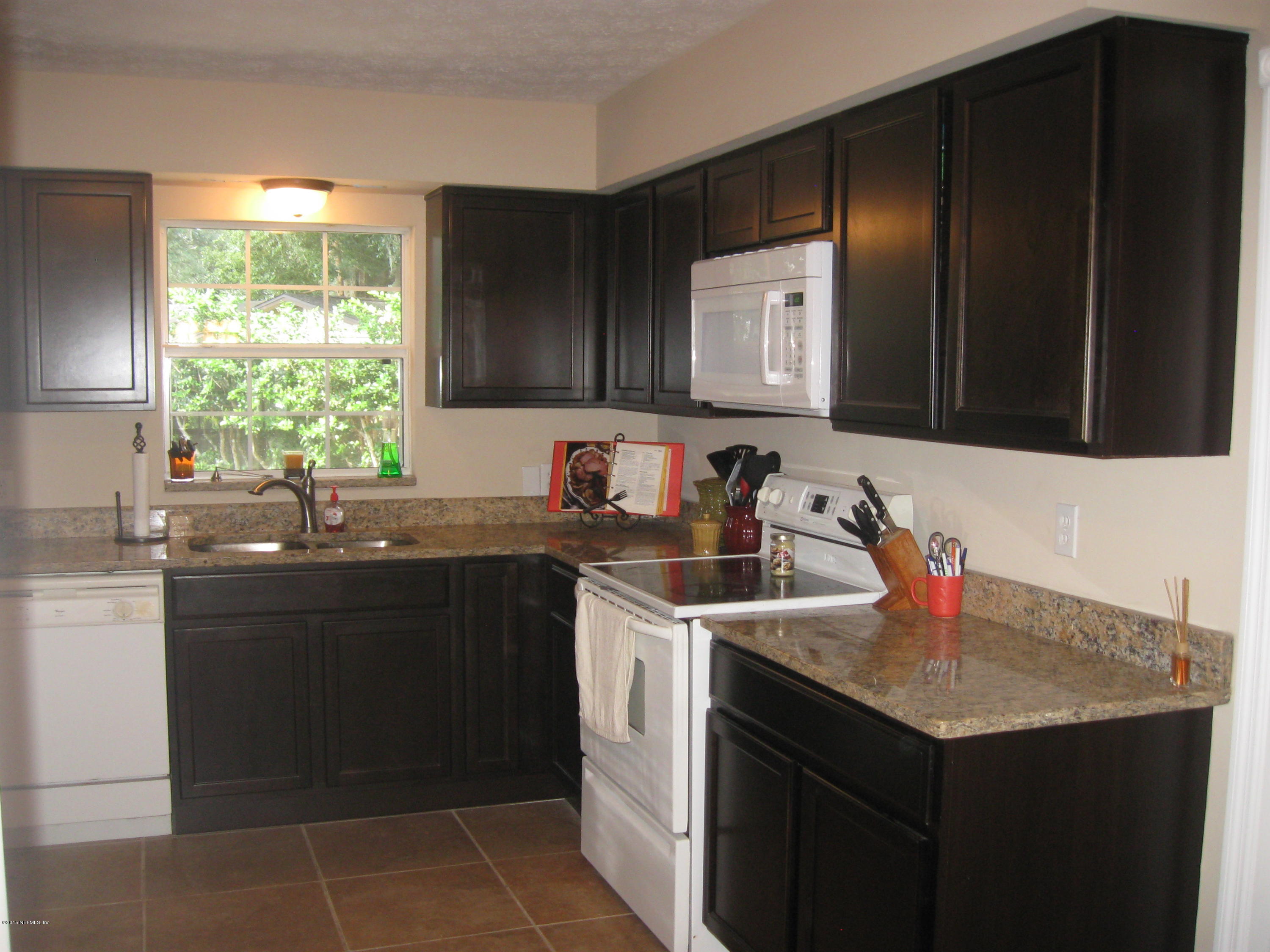 5535 Weaver Road Orange Park, FL 32073 - Photo 5 of 31 a kitchen with a sink and cabinets