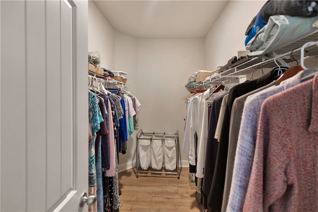 121 Ventura Street Anderson, SC 29621 - Photo 20 of 32 Custom built-in shelving and ample hanging space create an organized dressing area.
