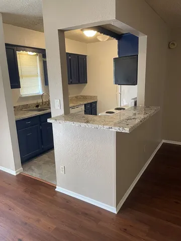 a view of living room with furniture and flat screen tv