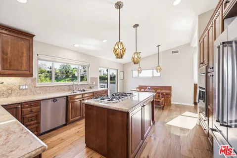 a kitchen with stainless steel appliances granite countertop counter space a sink and a window