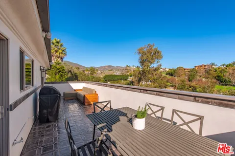 a view of outdoor seating area with furniture