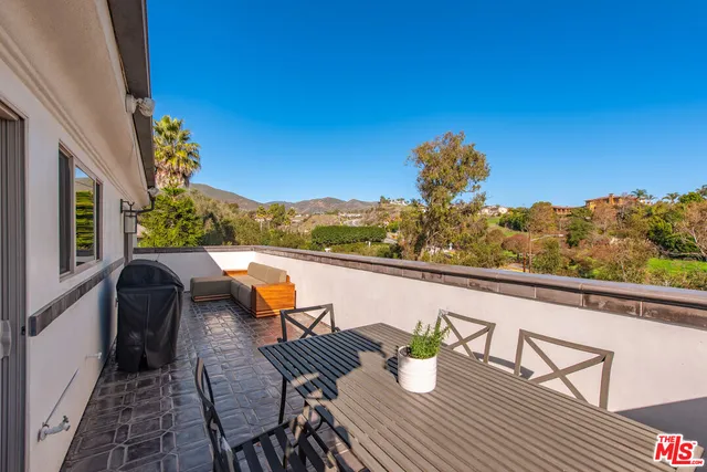 a view of outdoor seating area with furniture