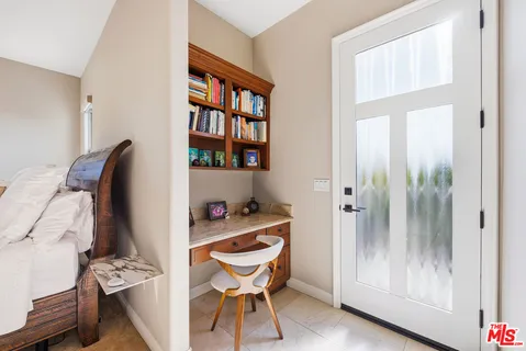 a view of a livingroom with furniture and front door