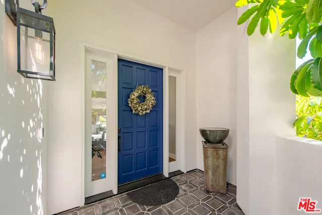 a view of an entryway with wooden floor