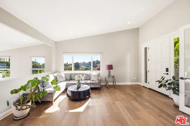 a living room with furniture or window and a wooden floor