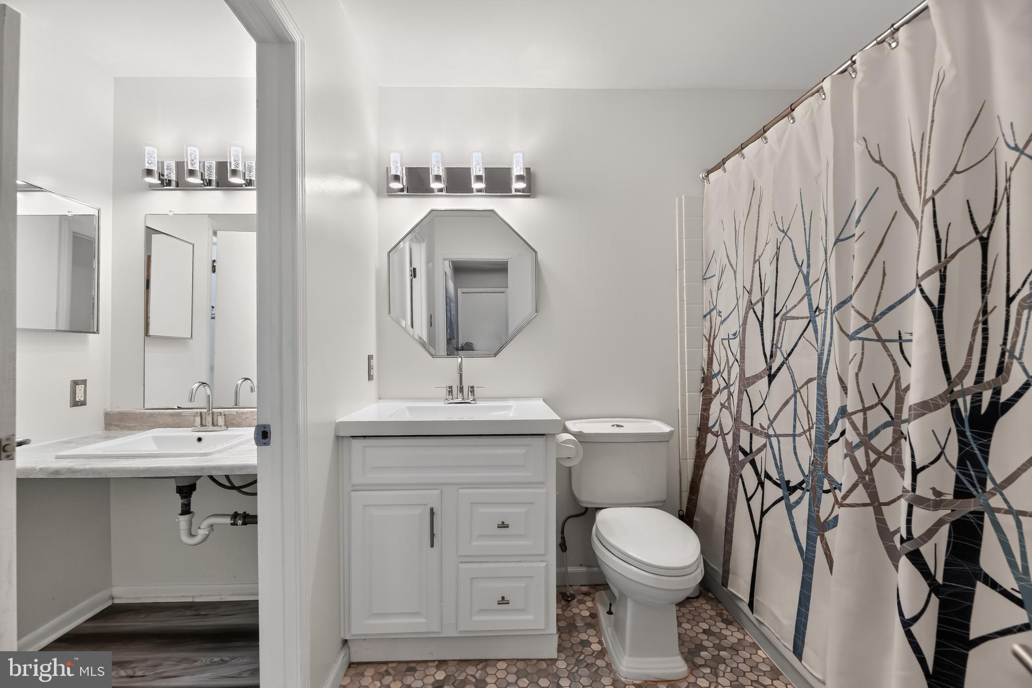 1802 Winding Way Clementon, NJ 08021 - Photo 19 of 30 a bathroom with a toilet sink and mirror