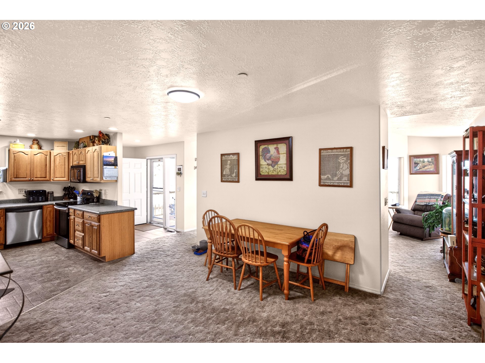 4377 Browns Creek Road The Dalles, OR 97058 - Photo 12 of 38 a living room with furniture and a kitchen area