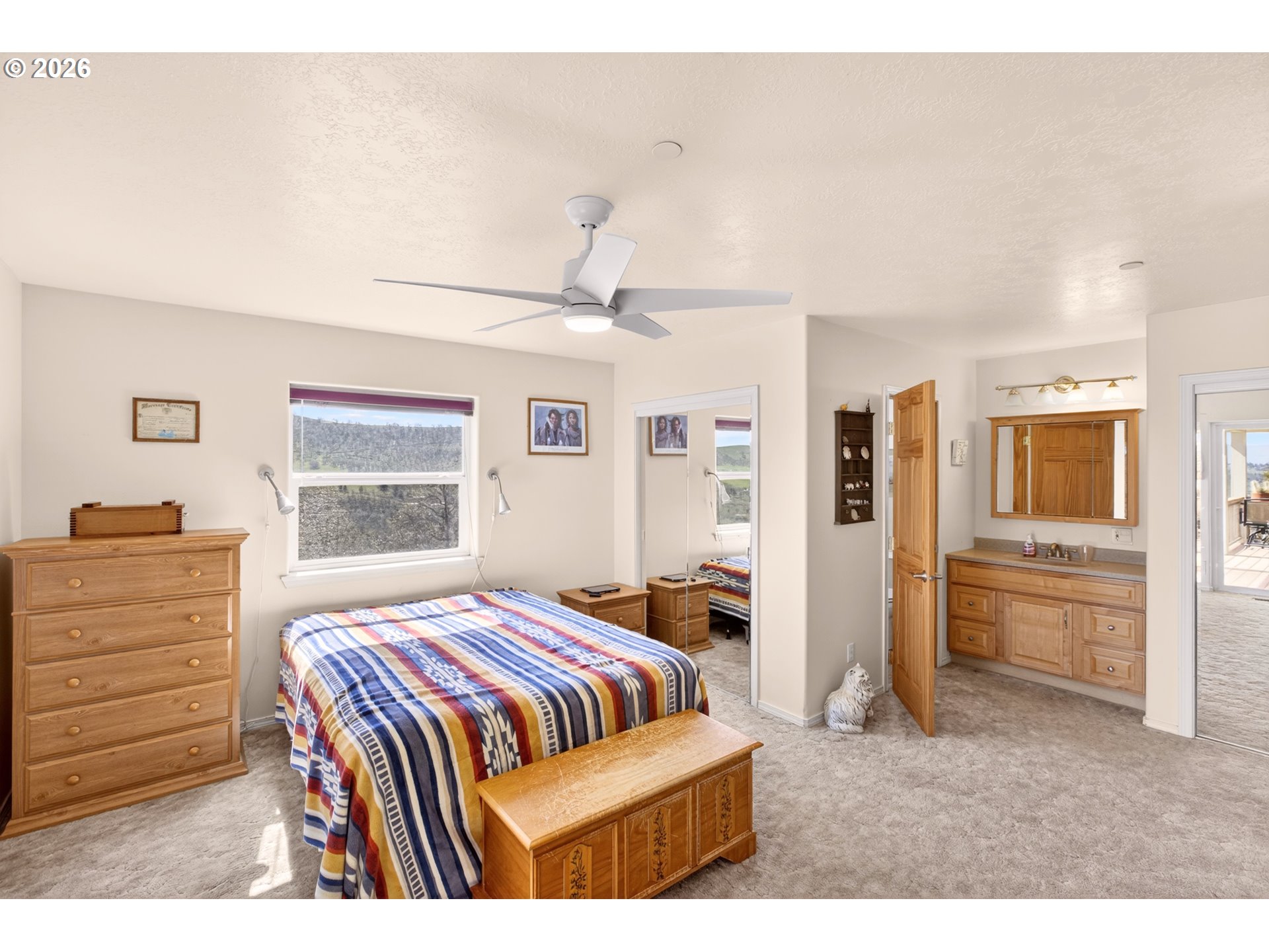 4377 Browns Creek Road The Dalles, OR 97058 - Photo 15 of 38 a bedroom with a bed and a dresser