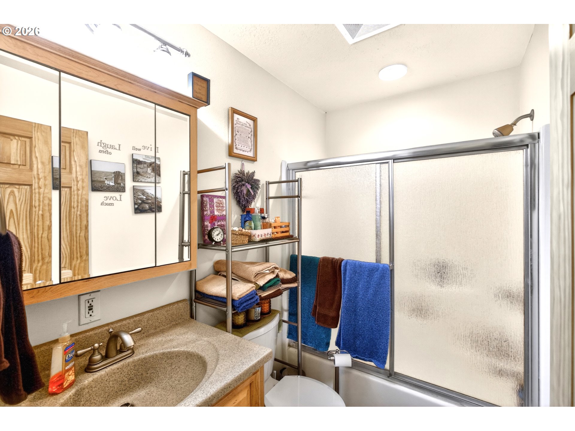 4377 Browns Creek Road The Dalles, OR 97058 - Photo 19 of 38 a bathroom with a sink mirror and a shower