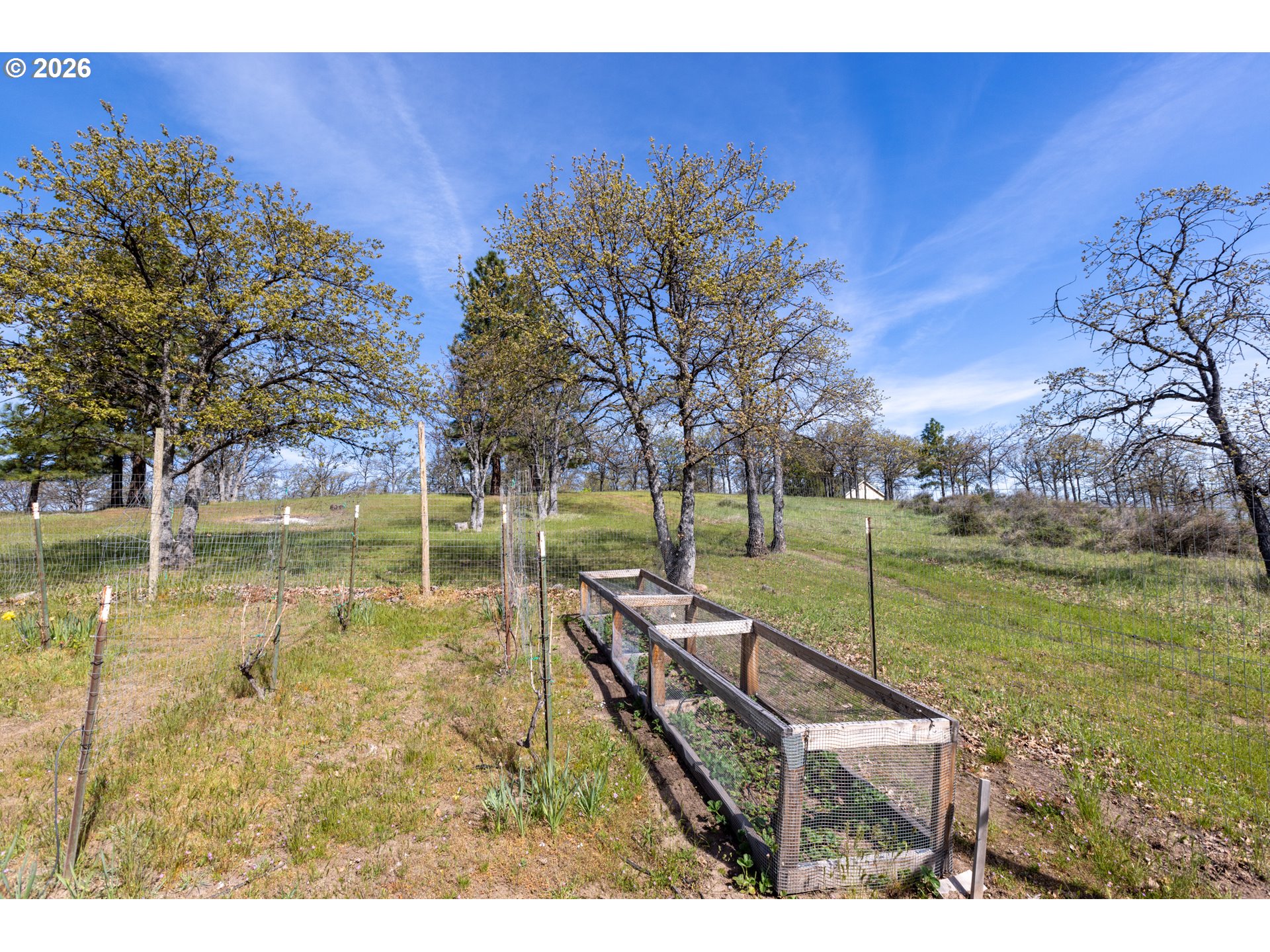 4377 Browns Creek Road The Dalles, OR 97058 - Photo 34 of 38 a backyard of a house with table and chairs
