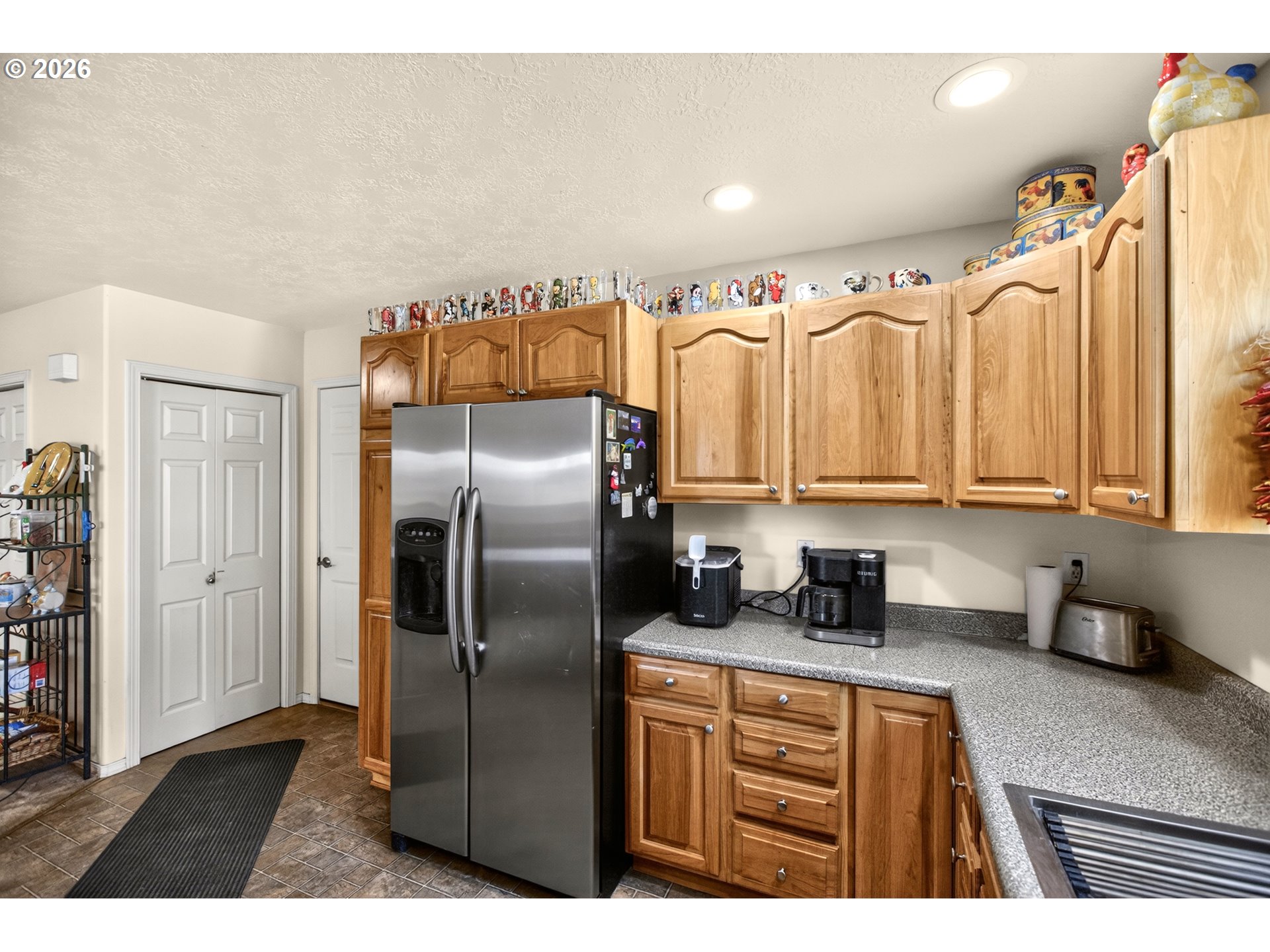 4377 Browns Creek Road The Dalles, OR 97058 - Photo 9 of 38 a kitchen with stainless steel appliances granite countertop a refrigerator a sink and a stove