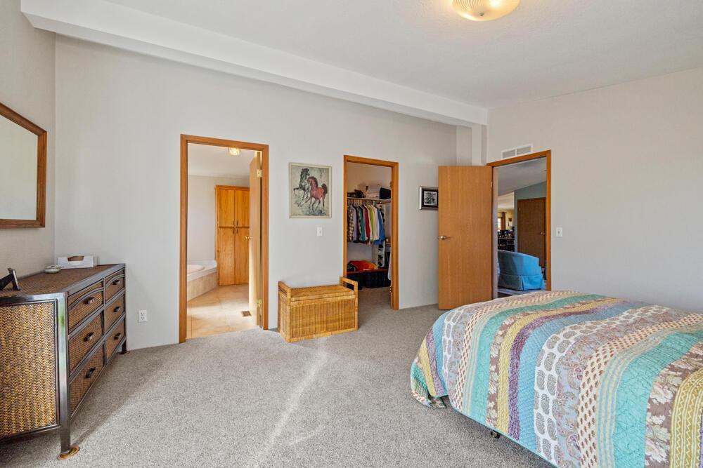 17550 South Poe Valley Road Klamath Falls, OR 97603 - Photo 22 of 59 a spacious bedroom with a bed and a cabinet