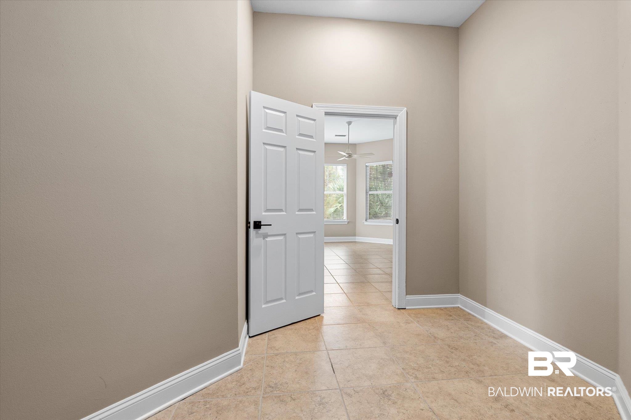 9259 Genipa Way Gulf Shores, AL 36542 - Photo 29 of 72 Corridor featuring light tile patterned floors