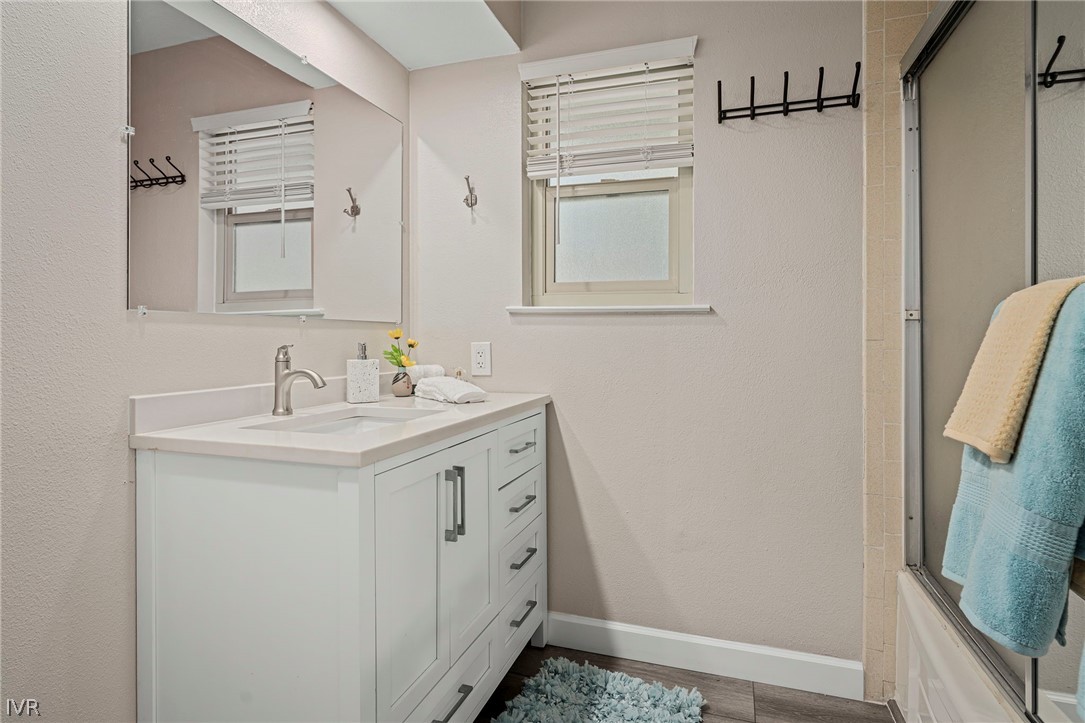 806 Oriole Way, Unit 16 Incline Village, NV 89451 - Photo 12 of 17 a bathroom with a sink a mirror and a shower