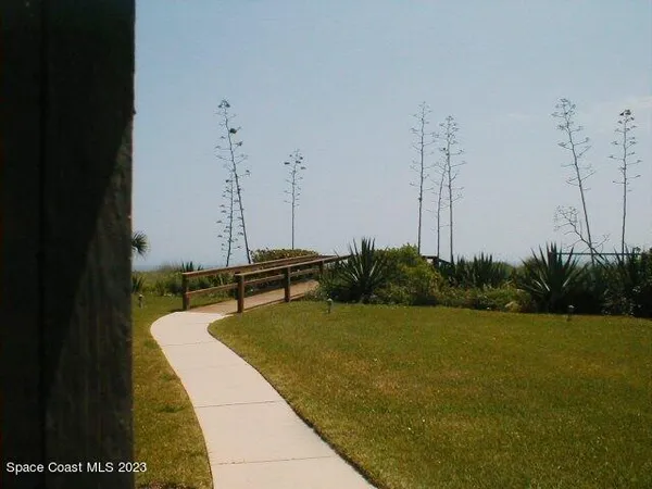 a kitchen with stainless steel appliances kitchen island granite countertop a sink and cabinets