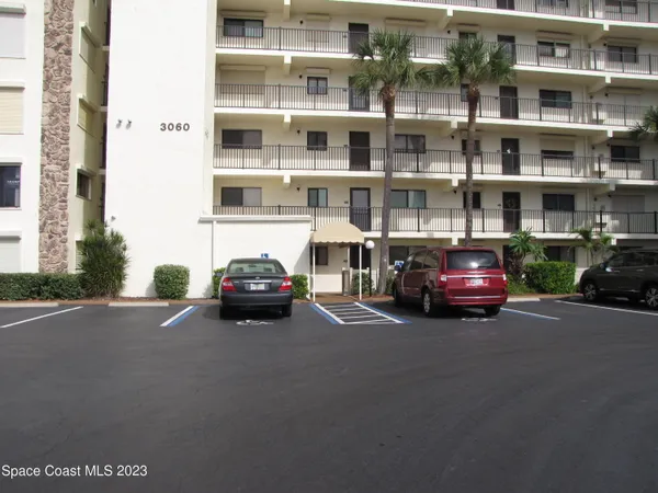 a view of a cars parked in front of a building