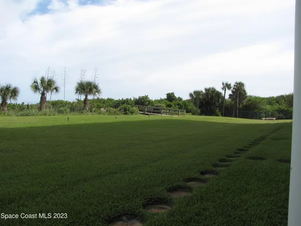 a view of a golf course with a lake