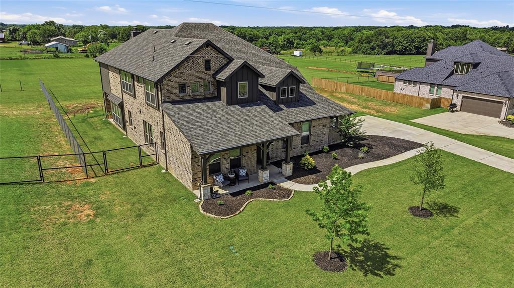 864 Shadow Valley Road Whitesboro, TX 76273 - Photo 2 of 40 Brick exterior with dark trim accents and multiple gables