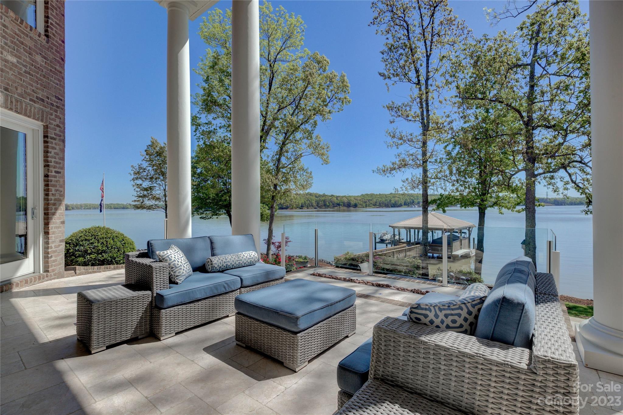 4269 River Oaks Road Clover, SC 29710 - Photo 18 of 48 a view of a patio with couches and a potted plant on a table and chairs