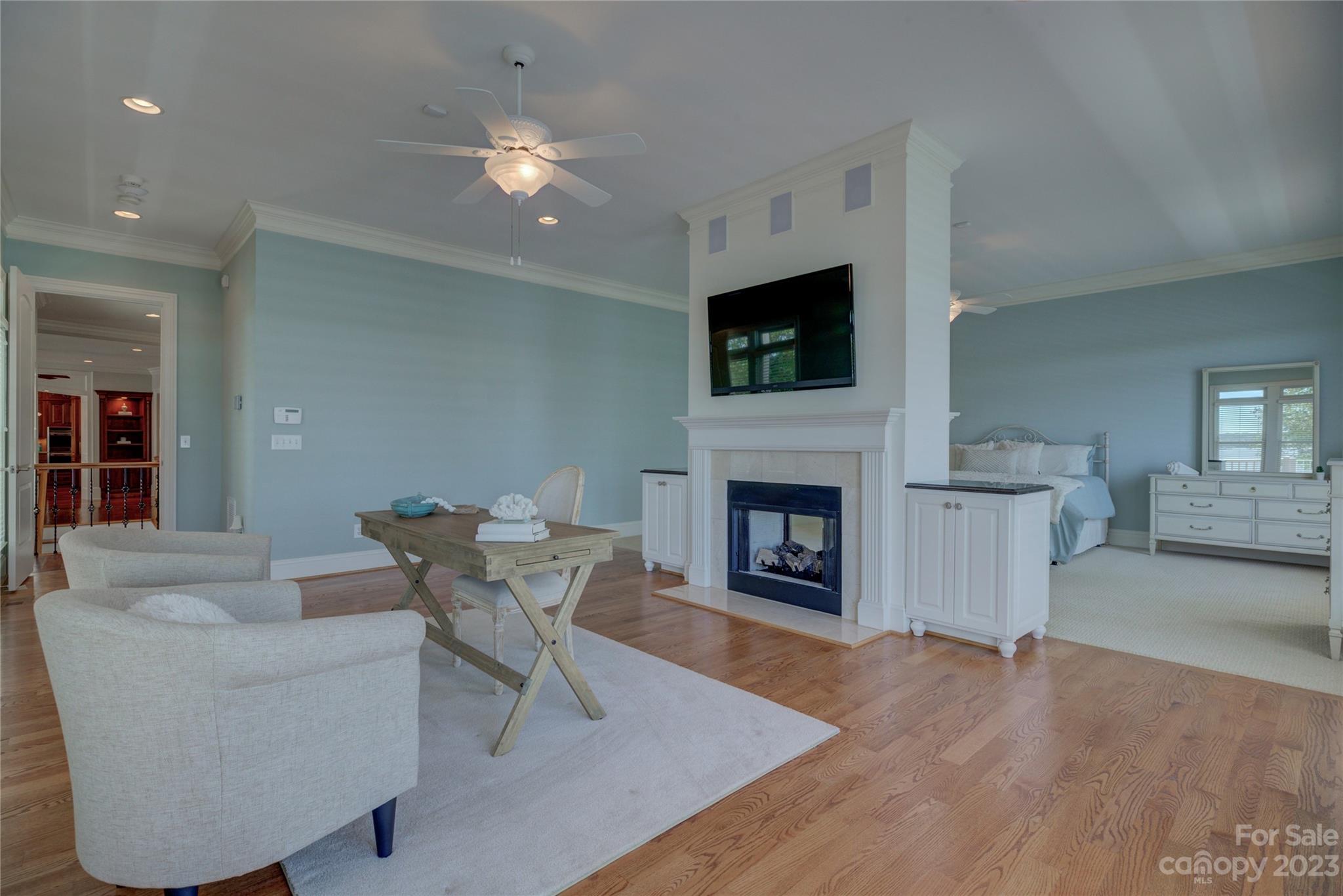 4269 River Oaks Road Clover, SC 29710 - Photo 22 of 48 a living room with furniture a fireplace and a flat screen tv