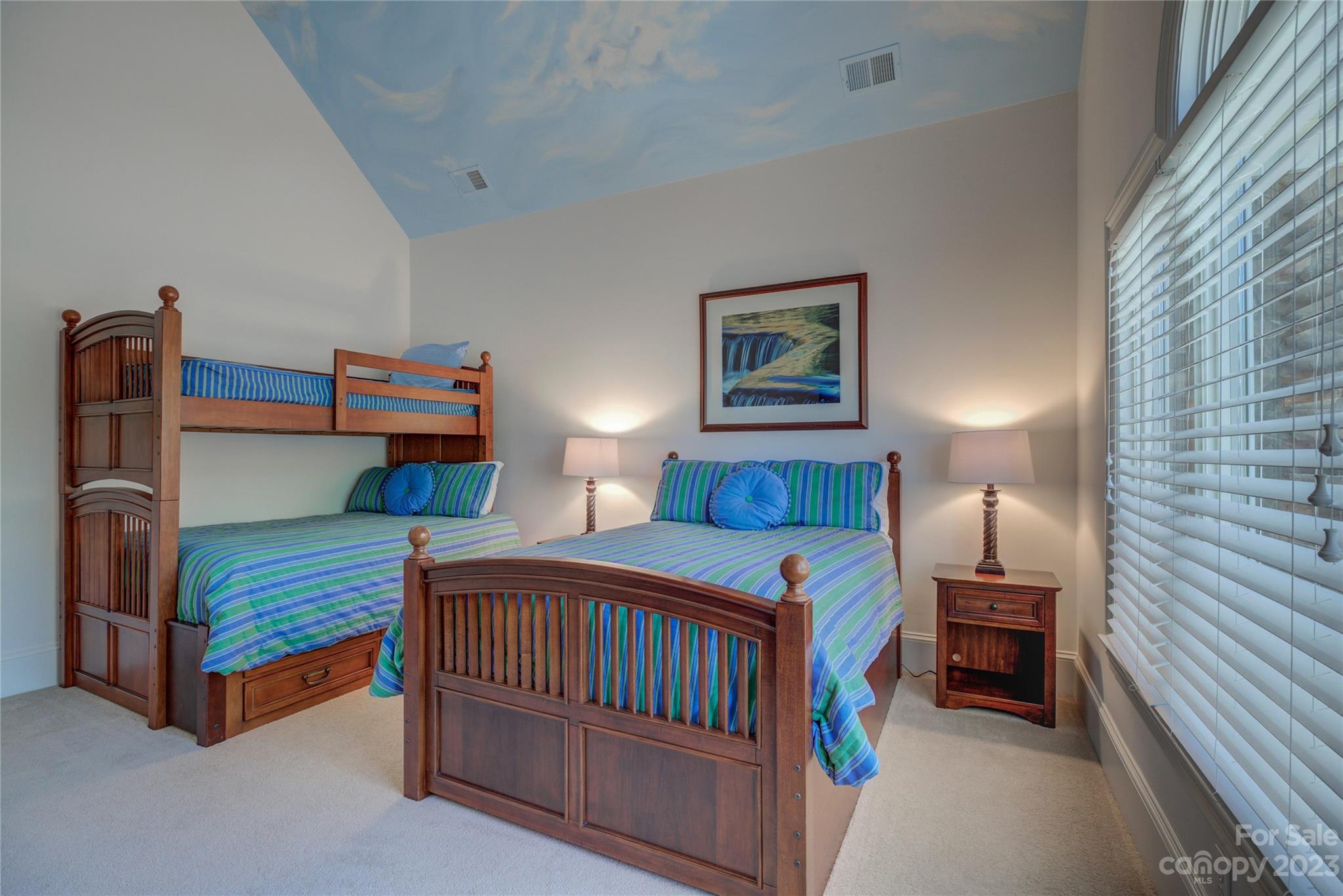 4269 River Oaks Road Clover, SC 29710 - Photo 35 of 48 a bedroom with bed and a chandelier