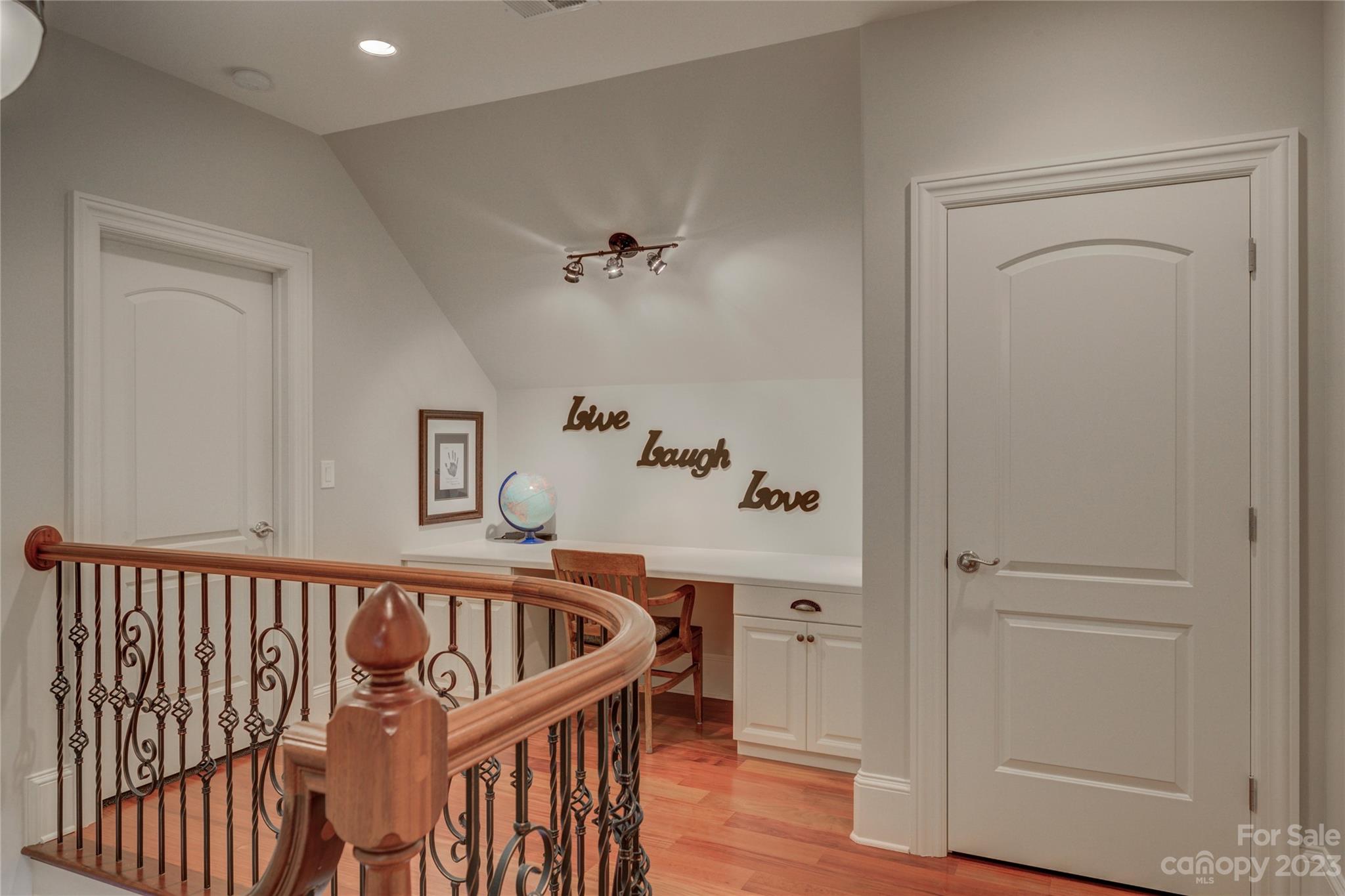 4269 River Oaks Road Clover, SC 29710 - Photo 39 of 48 a view of a hallway with a white walls and wooden floor