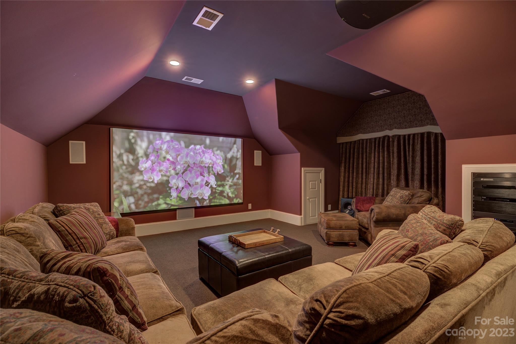 4269 River Oaks Road Clover, SC 29710 - Photo 40 of 48 a media room with lots of chairs and a projector screen