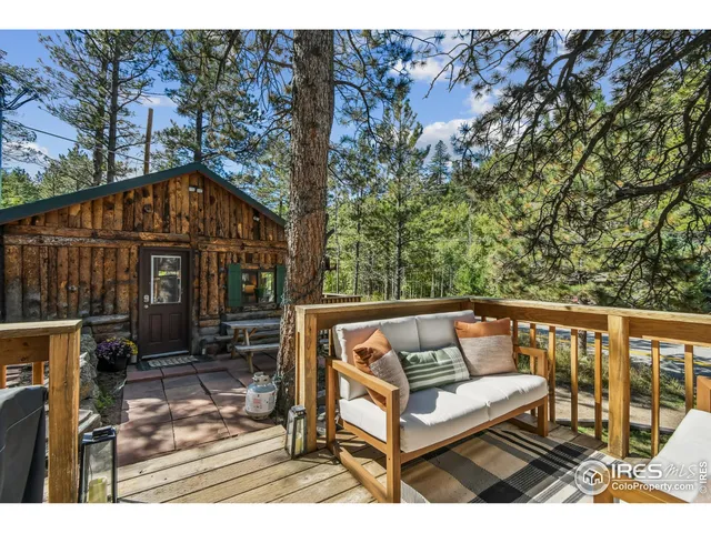 a view of a bench in the backyard