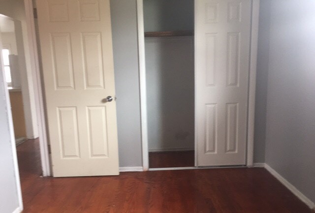 725 East 152nd Street Phoenix, IL 60426 - Photo 6 of 13 a view of an empty room with wooden floor