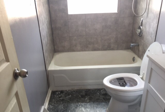 725 East 152nd Street Phoenix, IL 60426 - Photo 8 of 13 a bathroom with a sink a toilet and bathtub