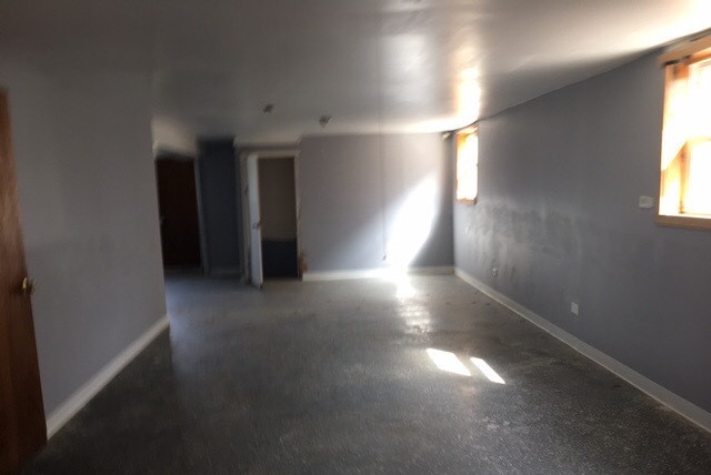 725 East 152nd Street Phoenix, IL 60426 - Photo 9 of 13 an empty room with windows and closet