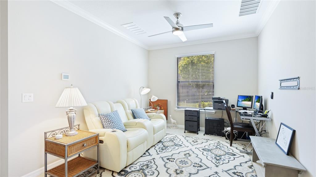 13719 Messina Loop, Unit 101 Lakewood Ranch, FL 34211 - Photo 12 of 77 a living room with furniture and a window