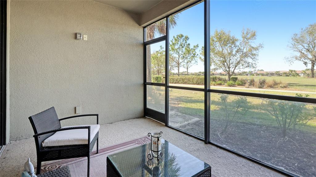13719 Messina Loop, Unit 101 Lakewood Ranch, FL 34211 - Photo 20 of 77 a view of a room with a floor to ceiling window