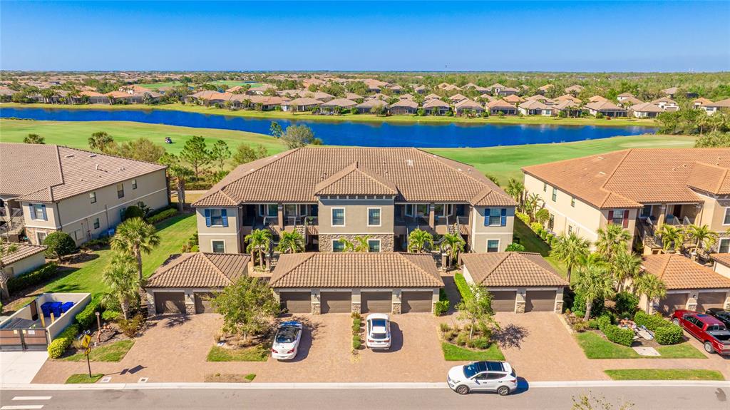13719 Messina Loop, Unit 101 Lakewood Ranch, FL 34211 - Photo 2 of 77 an aerial view of a house with a ocean view