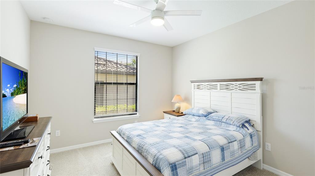 13719 Messina Loop, Unit 101 Lakewood Ranch, FL 34211 - Photo 26 of 77 a bedroom with a bed and a window