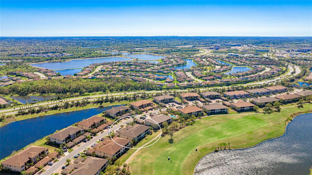 13719 Messina Loop, Unit 101 Lakewood Ranch, FL 34211 - Photo 3 of 77 an aerial view of residential houses with outdoor space