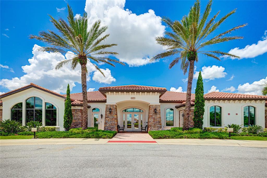 13719 Messina Loop, Unit 101 Lakewood Ranch, FL 34211 - Photo 37 of 77 a front view of a house with a garden and entryway
