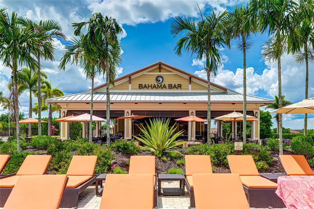 13719 Messina Loop, Unit 101 Lakewood Ranch, FL 34211 - Photo 44 of 77 a view of a patio with swimming pool