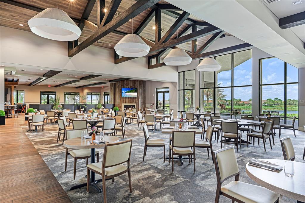 13719 Messina Loop, Unit 101 Lakewood Ranch, FL 34211 - Photo 52 of 77 a view of a dining room with furniture window and outside view