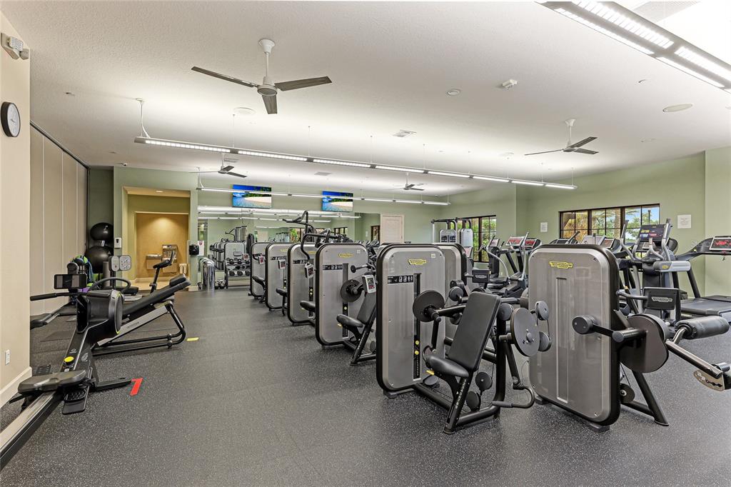 13719 Messina Loop, Unit 101 Lakewood Ranch, FL 34211 - Photo 59 of 77 a view of a room with gym equipment