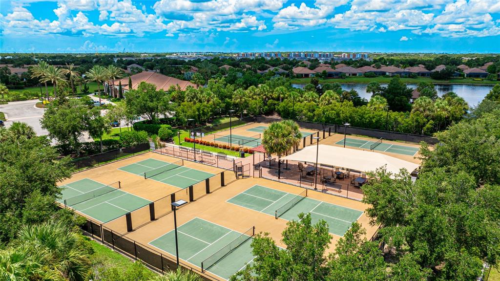 13719 Messina Loop, Unit 101 Lakewood Ranch, FL 34211 - Photo 63 of 77 an aerial view of a house with outdoor space and lake view