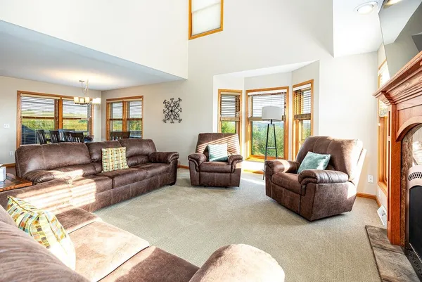 a living room with furniture and a floor to ceiling window