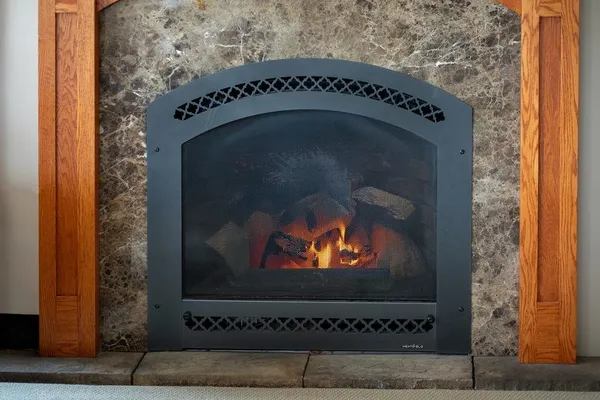 a living room with furniture and a lamp