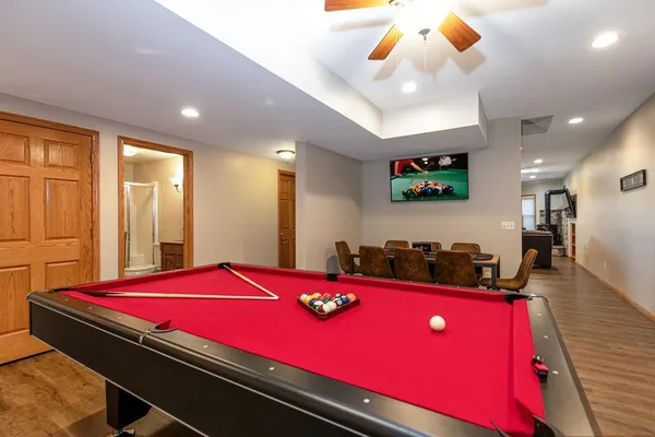 a view of a dining room with furniture wooden floor and chandelier