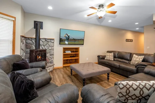 a kitchen with granite countertop white cabinets and white appliances