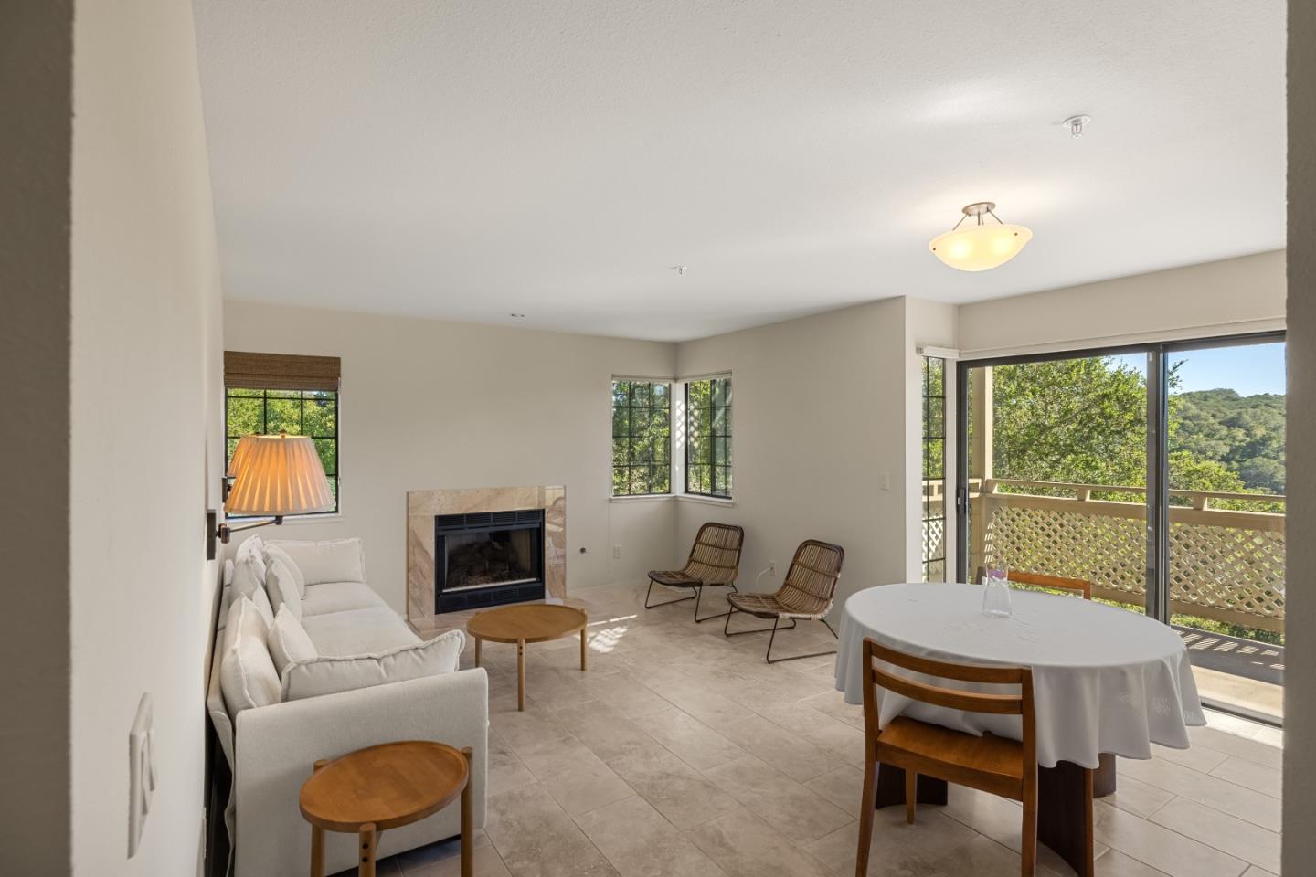 121 Quail Run Court Del Rey Oaks, CA 93940 - Photo 3 of 33 a living room with furniture a fireplace and a table