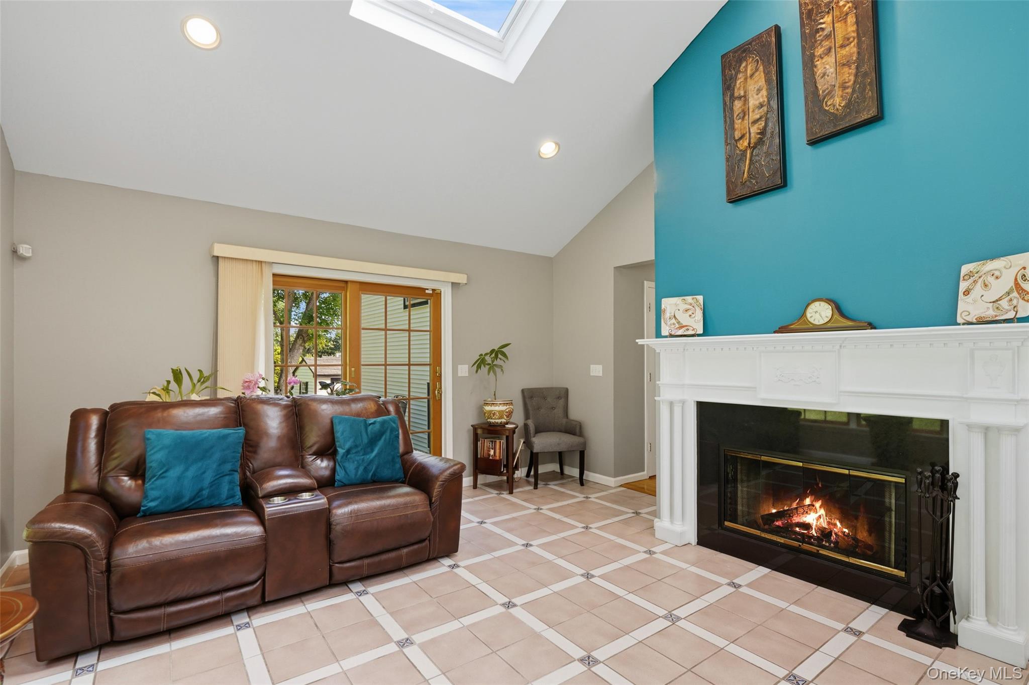 623 Cardinal Road Cortlandt Manor, NY 10567 - Photo 11 of 40 a living room with furniture a flat screen tv and a fireplace