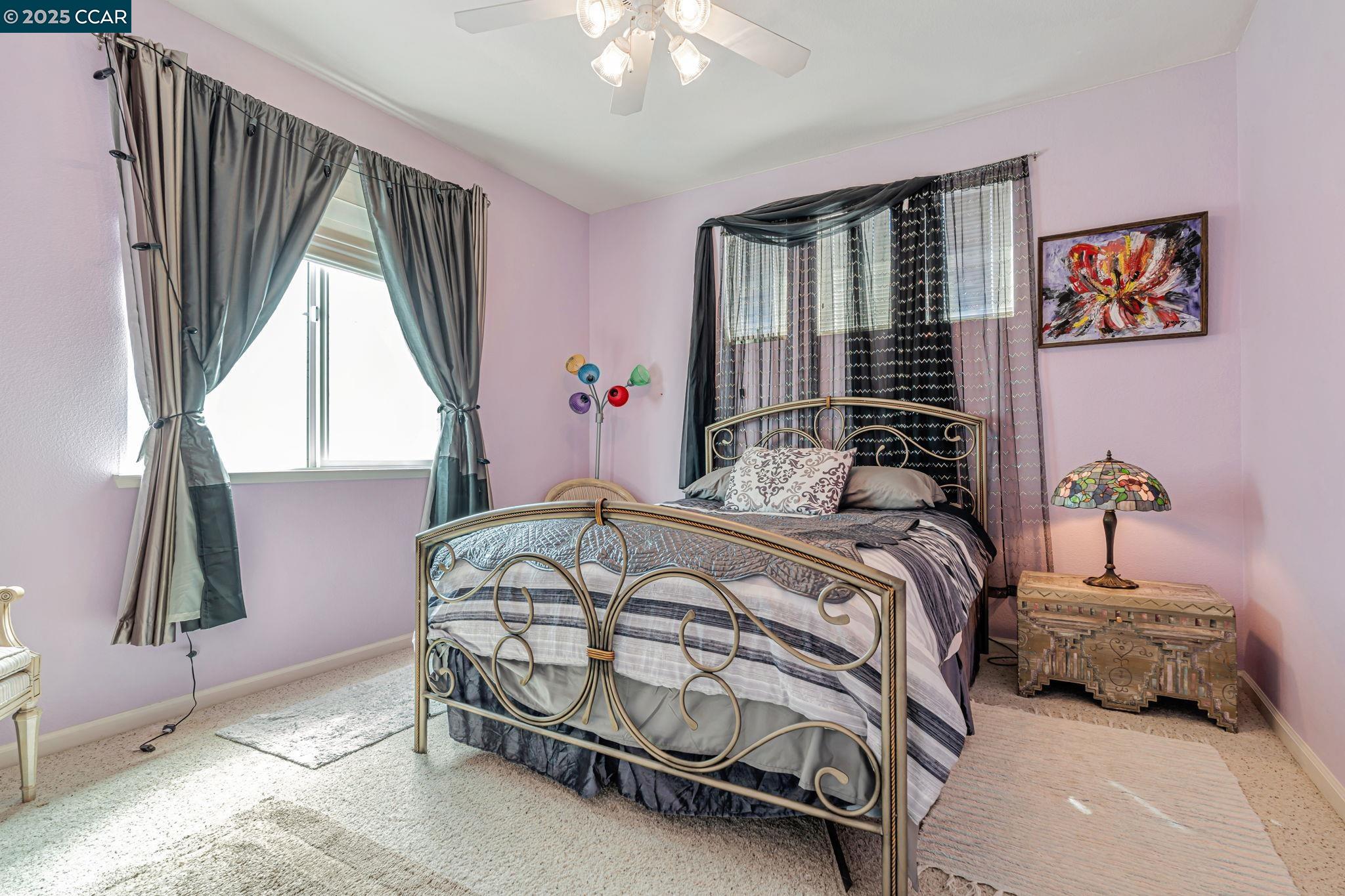 20640 Sarazen Place Patterson, CA 95363 - Photo 17 of 28 a bedroom with a bed and a window